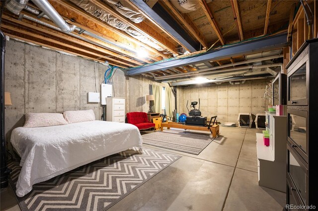 bedroom featuring concrete floors