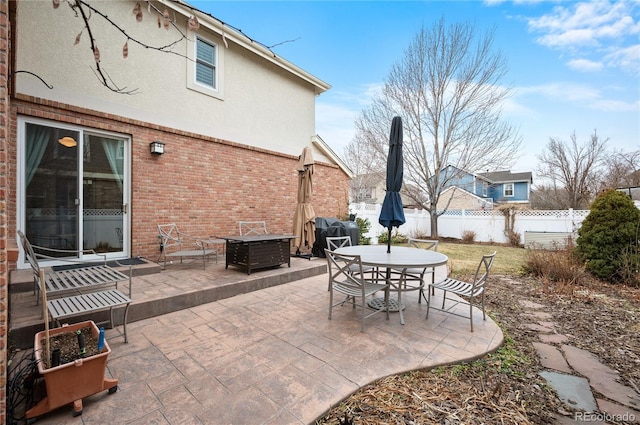 view of patio / terrace featuring outdoor dining space and fence