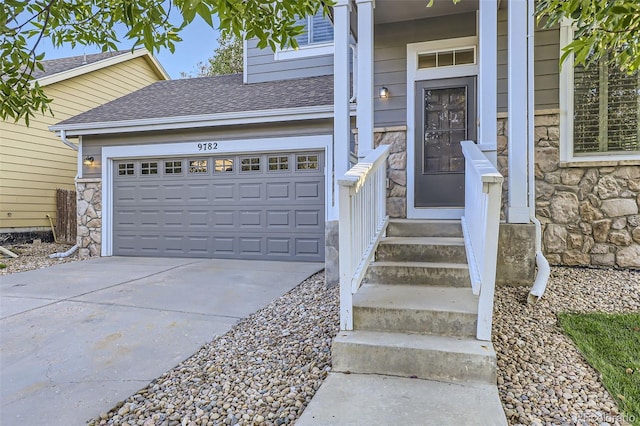 view of exterior entry featuring a garage