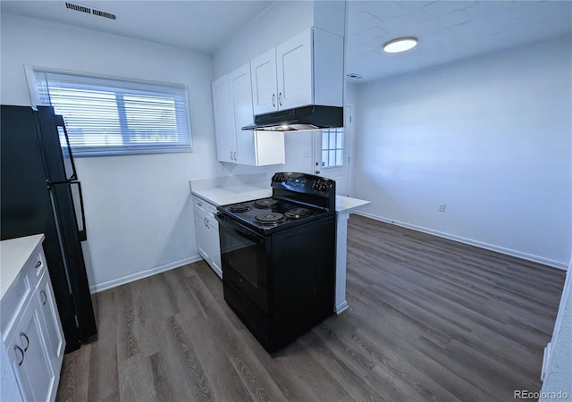 kitchen with black appliances, dark hardwood / wood-style floors, and white cabinets