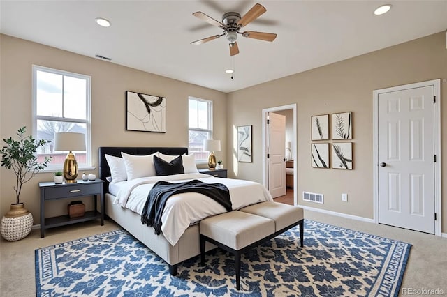bedroom featuring light colored carpet, baseboards, recessed lighting, and ceiling fan