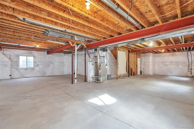 basement featuring gas water heater and heating unit