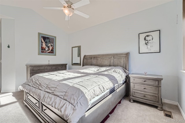 carpeted bedroom with ceiling fan and lofted ceiling