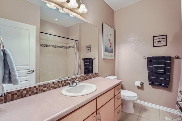 bathroom with vanity, toilet, curtained shower, and tile patterned flooring