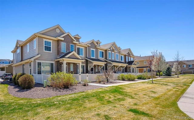 16285 W 62nd Ln Unit C, Arvada, CO 80403 - view of property featuring a residential view and a front lawn