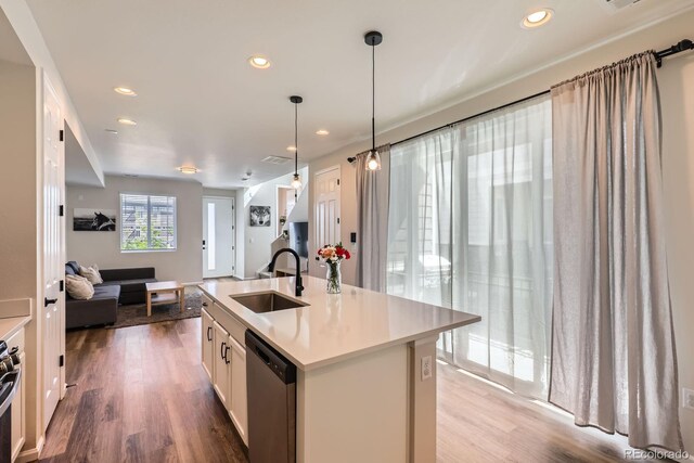 24374 E 42nd Ave, Aurora, CO 80019 - kitchen with a sink, stainless steel appliances, open floor plan, recessed lighting, and wood finished floors