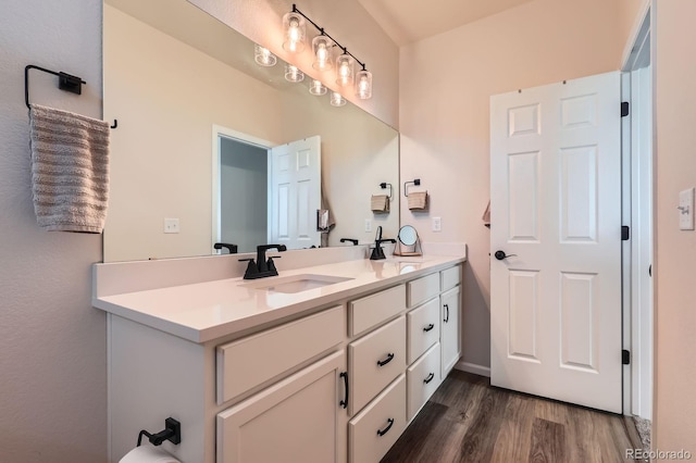 24374 E 42nd Ave, Aurora, CO 80019 - bathroom featuring wood finished floors and double vanity