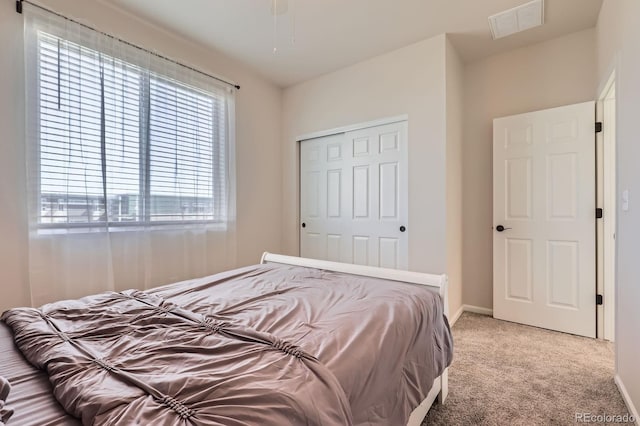 24374 E 42nd Ave, Aurora, CO 80019 - bedroom featuring light carpet, baseboards, and a closet