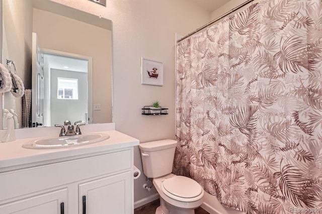 24374 E 42nd Ave, Aurora, CO 80019 - bathroom with toilet, vanity, and a shower with shower curtain