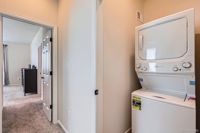 24374 E 42nd Ave, Aurora, CO 80019 - washroom with stacked washer / drying machine and light carpet