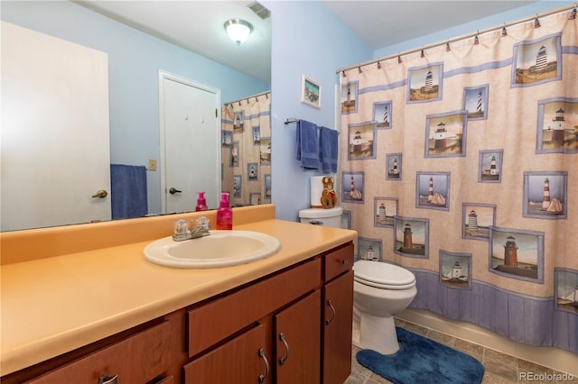 bathroom with vanity, toilet, tile patterned floors, a shower with curtain, and visible vents