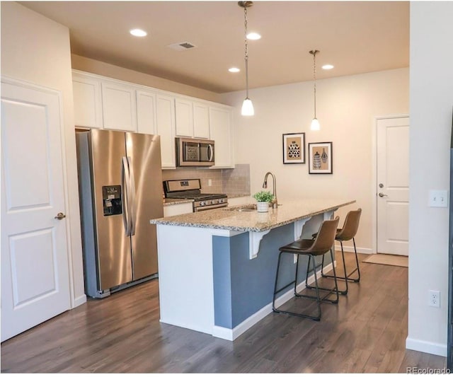 15476 W 64th Loop Unit C, Arvada, CO 80007 - kitchen featuring a sink, white cabinets, stainless steel appliances, and visible vents