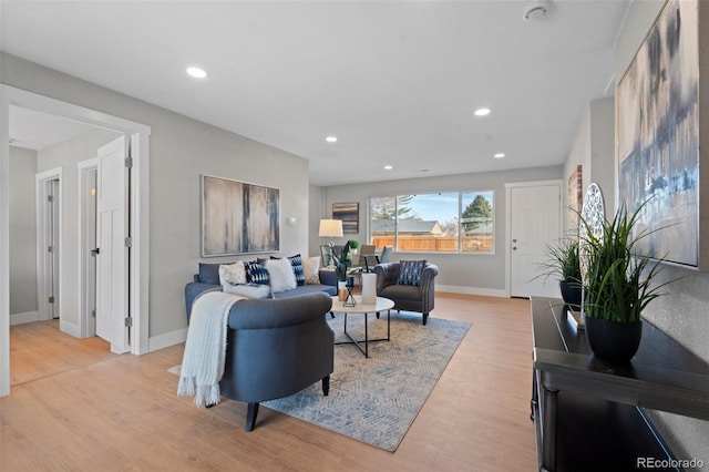 living room with light hardwood / wood-style flooring