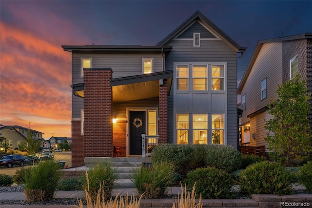 contemporary house featuring brick siding