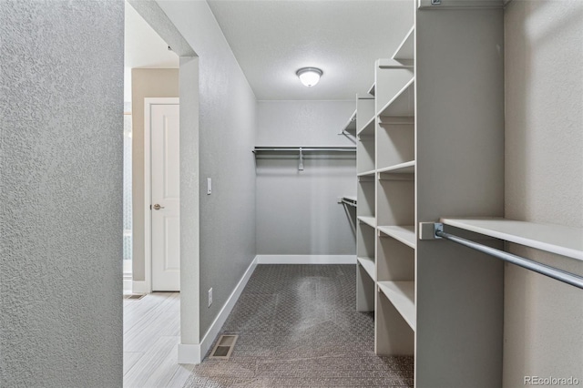 walk in closet featuring visible vents