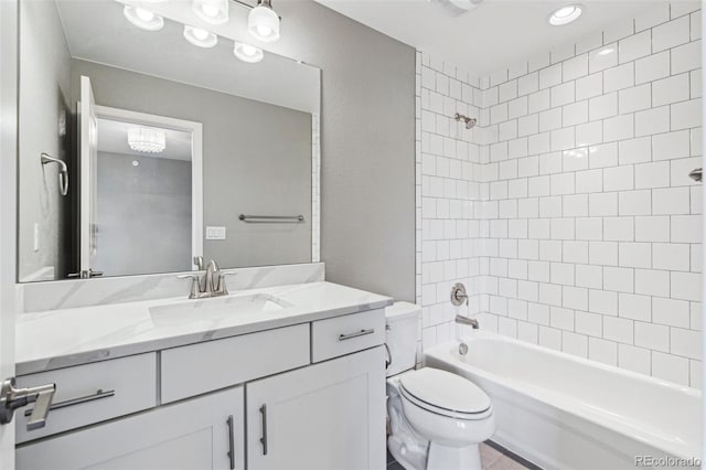 full bath with toilet, a textured wall, bathtub / shower combination, and vanity