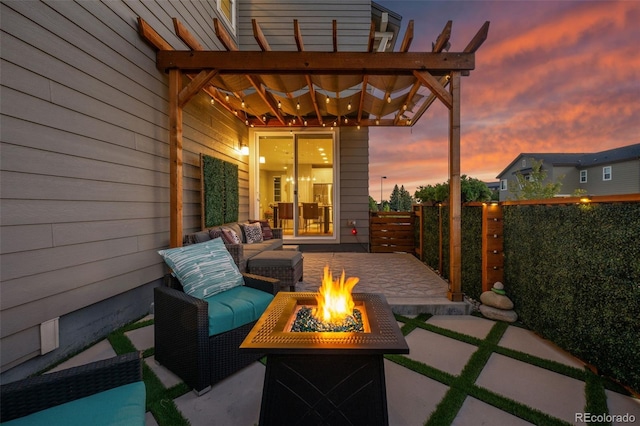 view of patio / terrace featuring fence, a pergola, and an outdoor living space with a fire pit