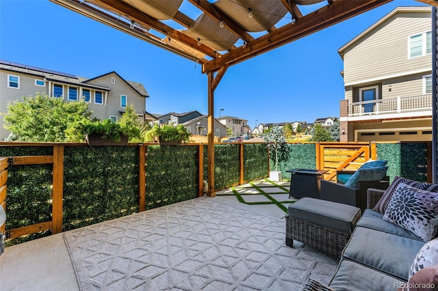 view of patio / terrace with a residential view and a pergola