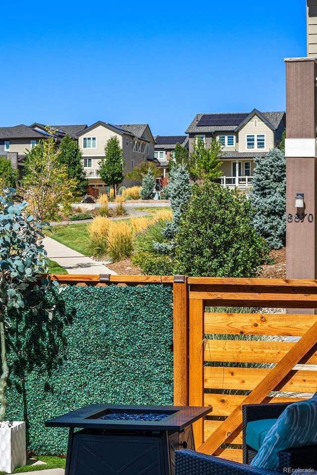 view of yard with a residential view and a fire pit