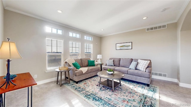 living area featuring baseboards, ornamental molding, visible vents, and recessed lighting