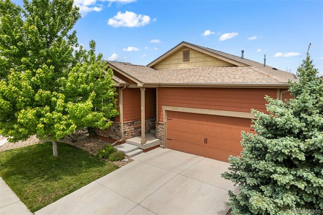 1836 Taos St, Brighton, CO 80603 - view of front of home featuring stone siding, driveway, a garage, and a shingled roof