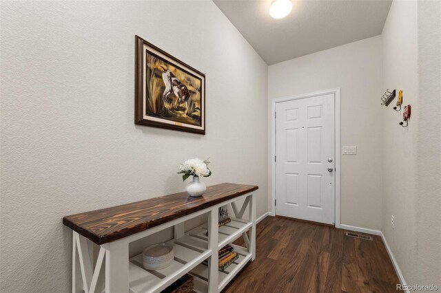 1836 Taos St, Brighton, CO 80603 - doorway to outside with dark wood finished floors and baseboards