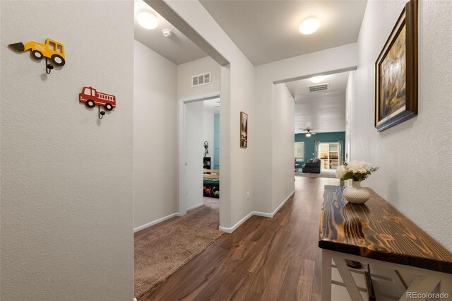 1836 Taos St, Brighton, CO 80603 - corridor featuring wood finished floors, baseboards, and a textured wall
