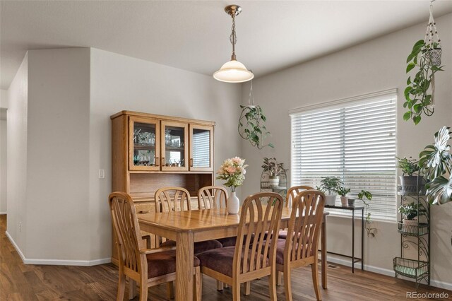 1836 Taos St, Brighton, CO 80603 - dining area featuring wood finished floors and baseboards