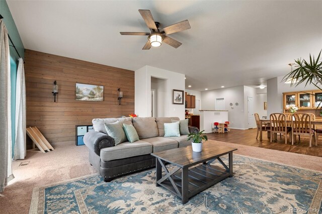 1836 Taos St, Brighton, CO 80603 - living room with wood walls, ceiling fan, and recessed lighting