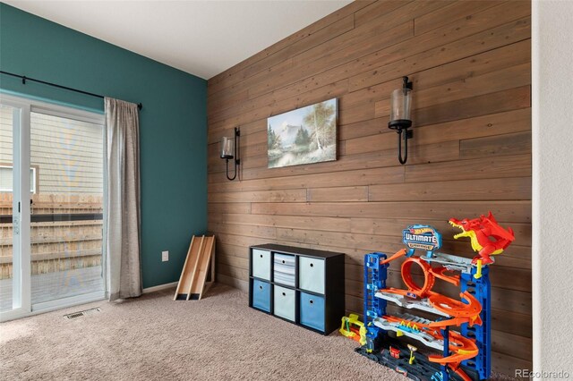 1836 Taos St, Brighton, CO 80603 - rec room featuring wood walls and carpet flooring