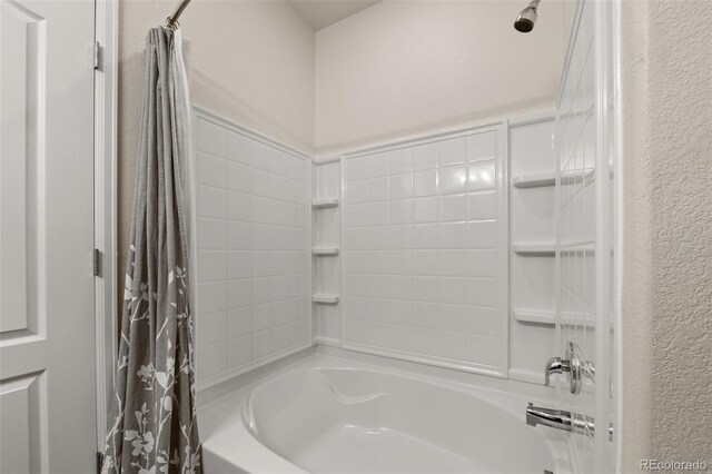 1836 Taos St, Brighton, CO 80603 - full bath featuring shower / tub combo with curtain and a textured wall