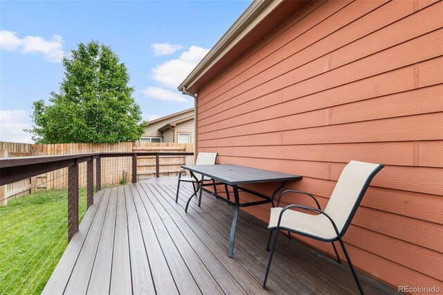 1836 Taos St, Brighton, CO 80603 - wooden terrace featuring outdoor dining space