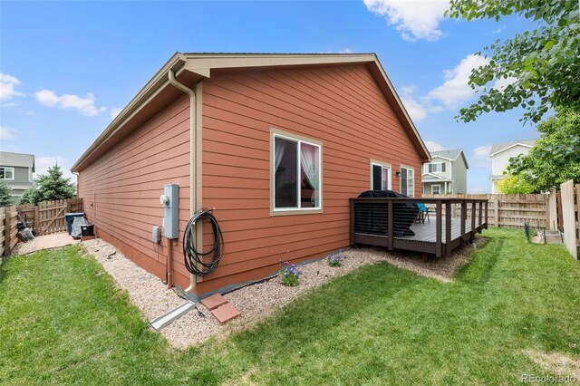 1836 Taos St, Brighton, CO 80603 - view of side of property with a deck