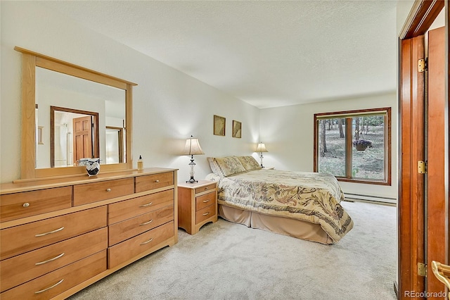 carpeted bedroom featuring a textured ceiling and baseboard heating