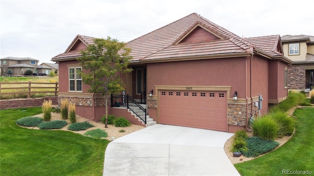 view of front facade with a front lawn and a garage