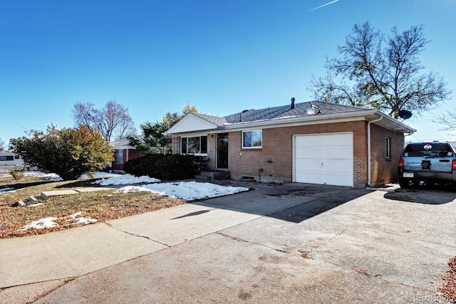 ranch-style house featuring a garage