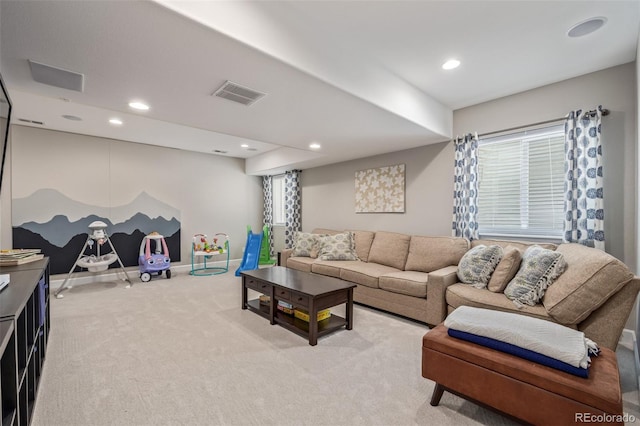 living area with light carpet, visible vents, recessed lighting, and baseboards