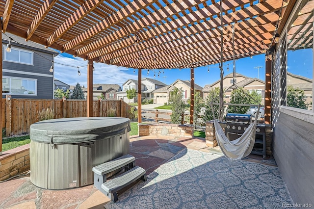 view of patio featuring a residential view, a fenced backyard, a pergola, and a hot tub