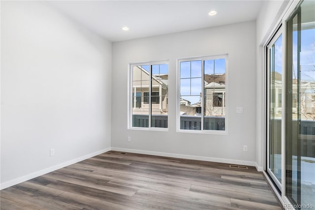 unfurnished room with dark hardwood / wood-style floors