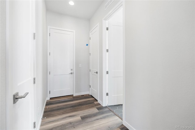 corridor with dark wood-type flooring