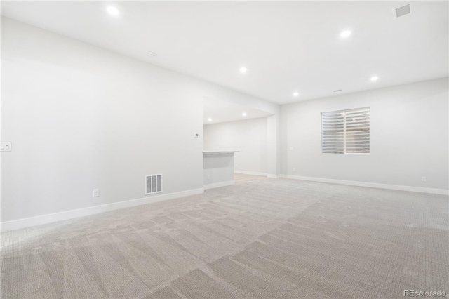 empty room featuring light carpet