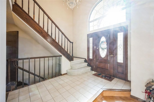 foyer entrance featuring a notable chandelier