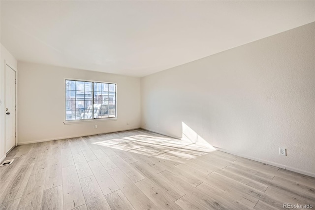 empty room featuring light hardwood / wood-style floors