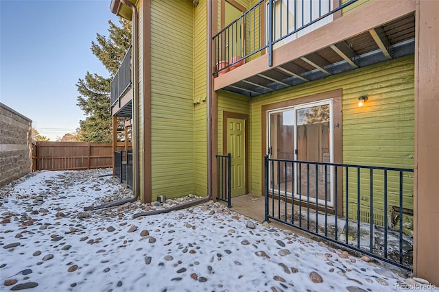 view of snow covered property entrance