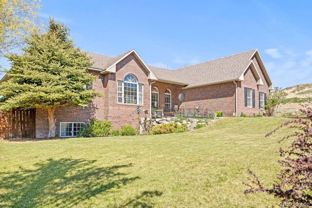 1060 Alta Vista Dr, Craig, CO 81625 - view of front facade featuring brick siding, a front yard, and roof with shingles