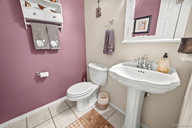 1060 Alta Vista Dr, Craig, CO 81625 - half bath with baseboards, toilet, and tile patterned floors