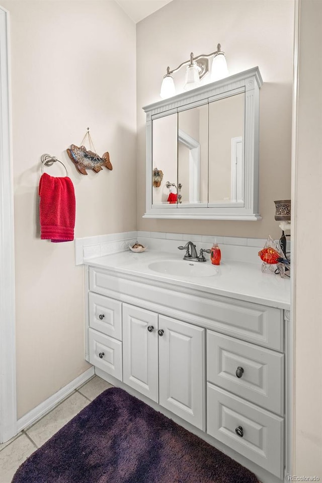 1060 Alta Vista Dr, Craig, CO 81625 - bathroom featuring vanity, tile patterned floors, and baseboards