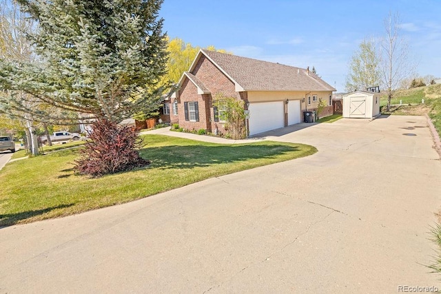 1060 Alta Vista Dr, Craig, CO 81625 - view of side of home with a storage shed, concrete driveway, brick siding, a lawn, and an outbuilding