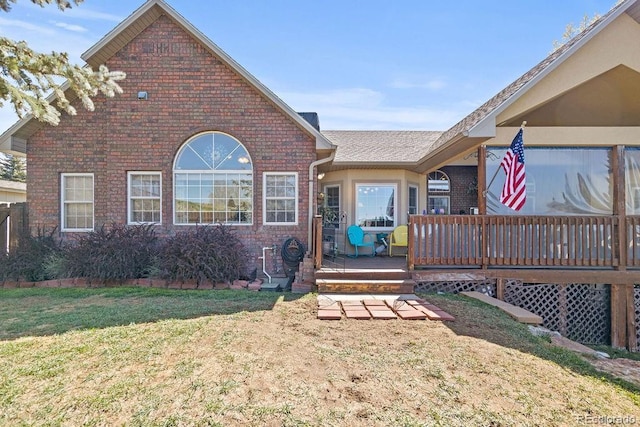 1060 Alta Vista Dr, Craig, CO 81625 - view of front of property featuring brick siding, a wooden deck, and a front yard