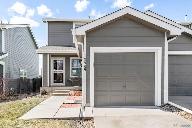 view of front of property with a garage and concrete driveway